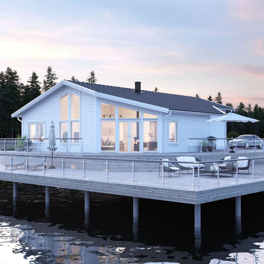 Vitt Villa Nidingen exteriör vid sjö